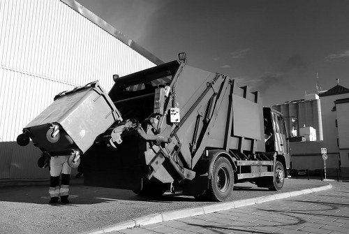 Business professionals managing waste in an office setting in South London